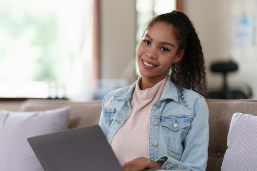 Beautiful woman using laptop working at home. lifestyle concept.