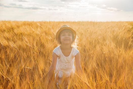 child in a wheat field. selective focus. nature