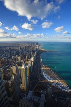 tall buildings and lakeshore drive in chicago in a clear day with lake michigan 