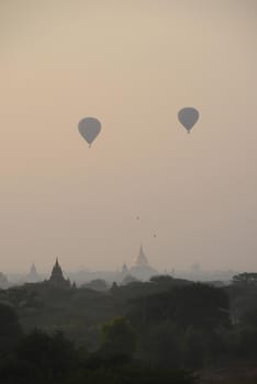 pagoda and hot air balloon in bagan myanmar in the morning