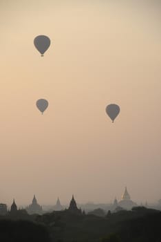 pagoda and hot air balloon in bagan myanmar in the morning