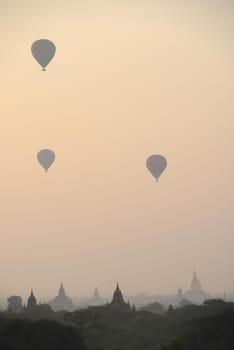 pagoda and hot air balloon in bagan myanmar in the morning