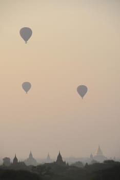 pagoda and hot air balloon in bagan myanmar in the morning