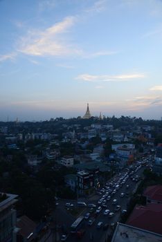 shwedagon pagoda surrounded by houses in yangon