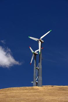 wind turbine power and cloud on grass hill