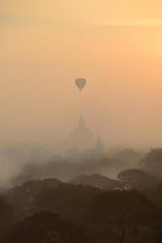 hot air balloon with pagoda in bagan