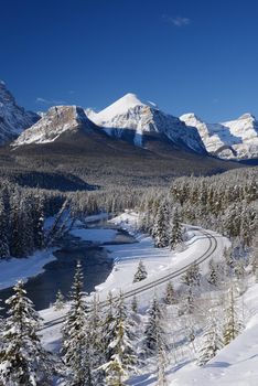 train curve at canadian rockies in winter