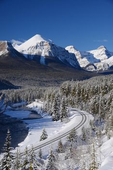 train curve at canadian rockies in winter