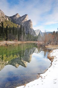 three peaks of the three sister with their reflection at yosemite national park