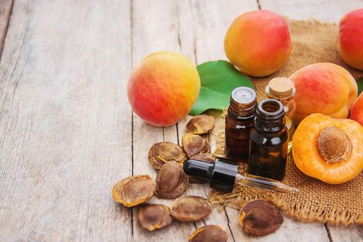 apricot oil in a small jar. selective focus. nature.