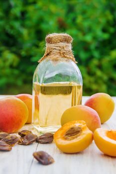 apricot oil in a small jar. selective focus. nature.