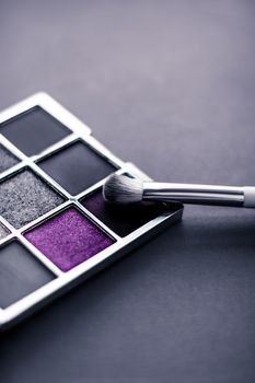 Cosmetic branding, mua and girly concept - Eyeshadow palette and make-up brush on graphite background, eye shadows cosmetics product for luxury beauty brand promotion and holiday fashion blog design