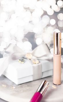 Cosmetic branding, Christmas glitter and girly blog concept - Holiday make-up foundation base, concealer and white gift box, luxury cosmetics present and blank label products for beauty brand design