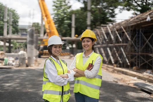 Portrait two engineer asian woman building contractors standing at construction site