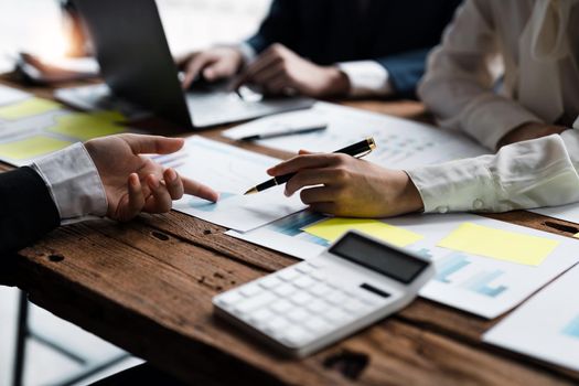 Business People Talking Discussing with coworker planning analyzing financial document data charts and graphs in Meeting and successful teamwork Concept