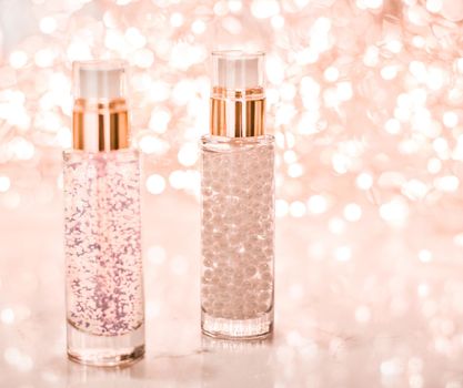 Cosmetic branding, blank label and glamour present concept - Holiday make-up base gel, serum emulsion, lotion bottle and rose gold glitter, luxury skin and body care cosmetics for beauty brand ads