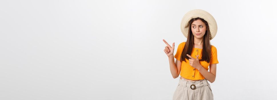 young pretty woman looking unhappy and stressed, suicide gesture making gun sign with hand, pointing to copy space