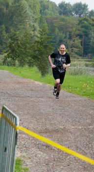 Running event in the Netherlands. Caucasian man jogging.