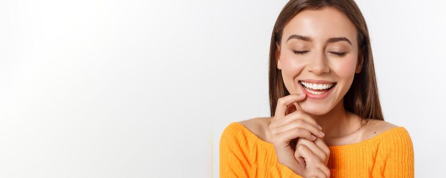 friendly smiling young woman with beatiful face portrait studio shot.