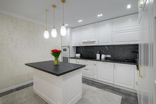 Luxury large modern domestic kitchen furniture with island and black marble worktop