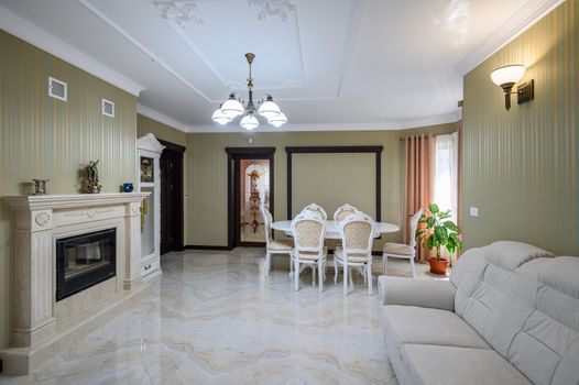 Classic living room interior design. Spacious room, luxury marble floor, elegant chairs and even fireplace