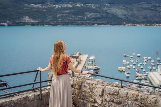 Woman tourist in Herceg Novi old town. Historical and touristic center of Herceg Novi. Montenegro.