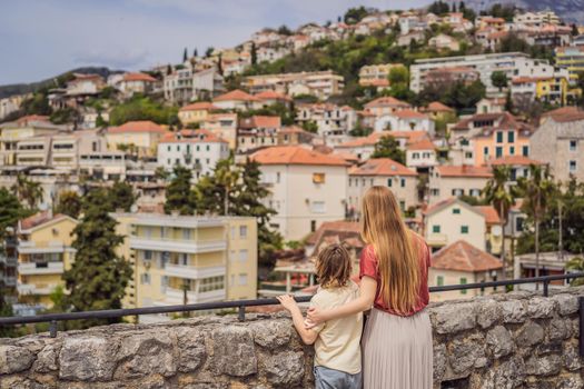 Mom and son tourists in Herceg Novi old town. Historical and touristic center of Herceg Novi. Montenegro.