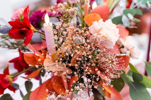 red autumn bouquet on the festive table.