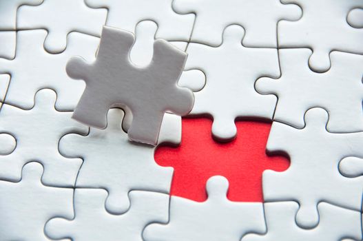 Copy space of white jigsaw puzzle for ideas or text.