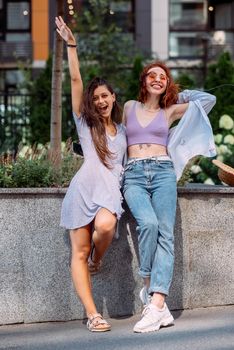 Two lovely girl friends hugging and having fun.