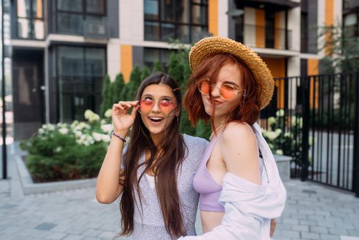 Two lovely girl friends hugging and having fun.