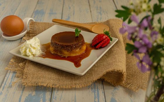 egg custard with cream and strawberries delicatessen