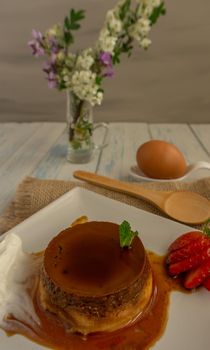 egg custard with cream and strawberries delicatessen