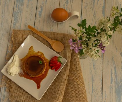 egg custard with cream and strawberries delicatessen