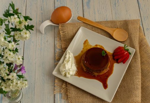 egg custard with cream and strawberries delicatessen