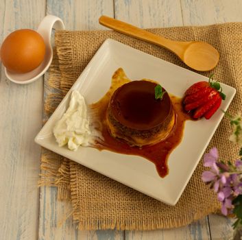 egg custard with cream and strawberries delicatessen