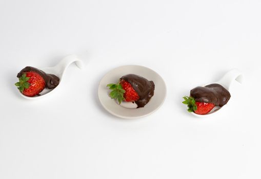 strawberries with chocolate on white background