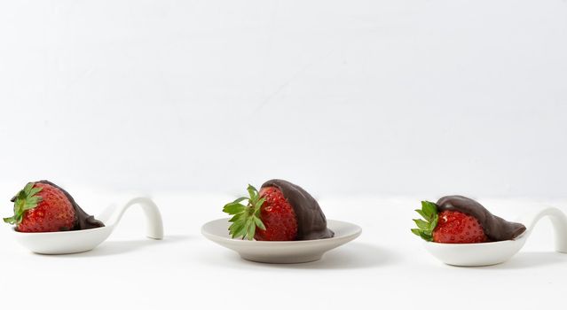 strawberries with chocolate on white background