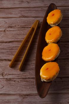 tortas locas or crazy cakes typical of andalucia, spain on a wooden bowl and some tongs