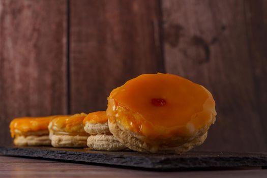 tortas locas or crazy cakes typical from andalucia, spain on a black tile on a wood background