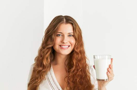 Diet, health and wellness concept, woman holding glass of milk or protein shake cocktail