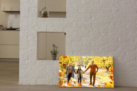 photo canvas with a family in autumn.