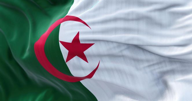 Close-up view of the Algeria national flag waving in the wind. People Democratic Republic of Algeria, is a country in North Africa. Fabric textured background. Selective focus