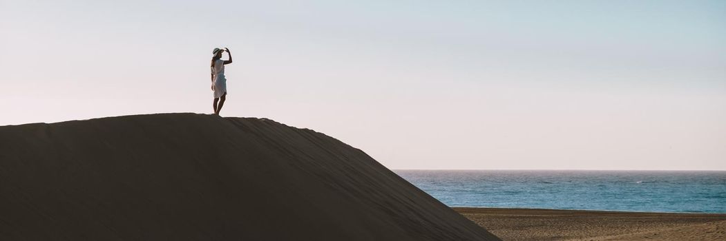 young woman at the dessert of Maspalomas sand dunes Gran Canaria during vacation at the Canary Islands. in Spain, Gran Canaria sand dunes