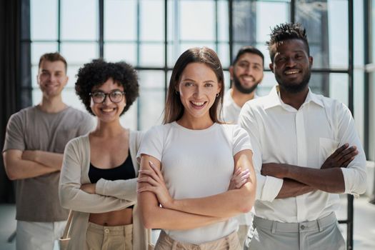 Face of beautiful woman on the background of business people