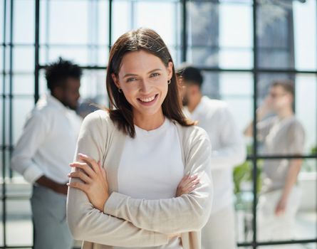 Face of beautiful woman on the background of business people