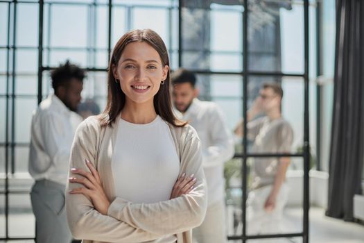 Face of beautiful woman on the background of business people