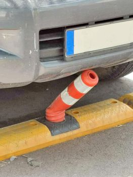 the car hit the plastic parking barrier with a bumper close up