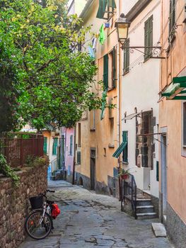 cinque terre, ancient road of Liguria with bicycle on the roadside and houses