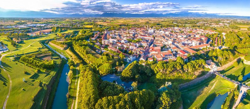 Scenic aerial panoramic view of town of Palmanova green landscape, star shape walls and trenches, UNESCO world heritage site in Friuli Venezia Giulia region of northern Italy